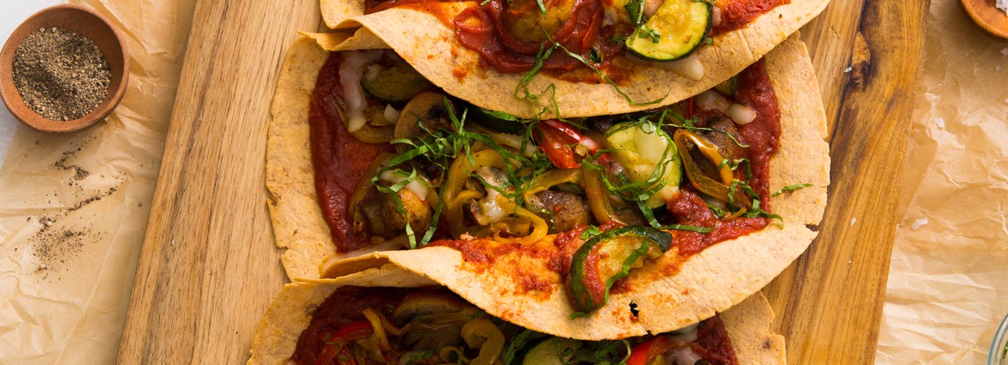 A colorful veggie pizza wrap