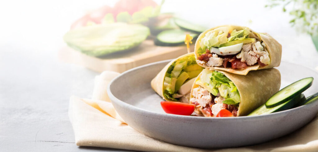 Healthy cobb salad wrap sliced diagonally