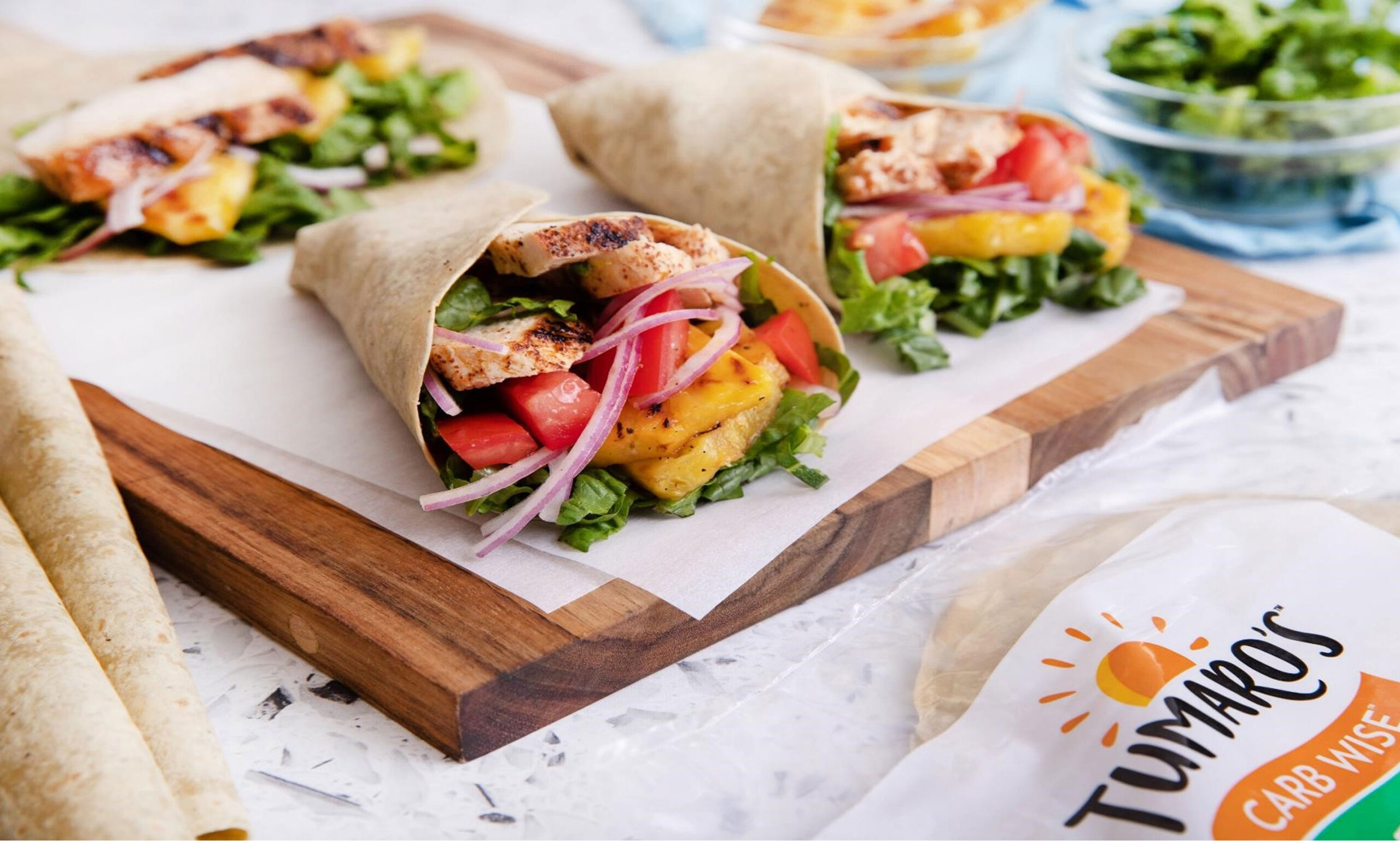 delicious wraps laid out on a cutting board